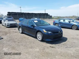 2019 Toyota Camry LE with VIN 4T1B11HK6KU276644, listed as a IAAI auction lot 42037249 with 23,677 mi miles and . Bid and sale history available at DreamBid. Image 1.