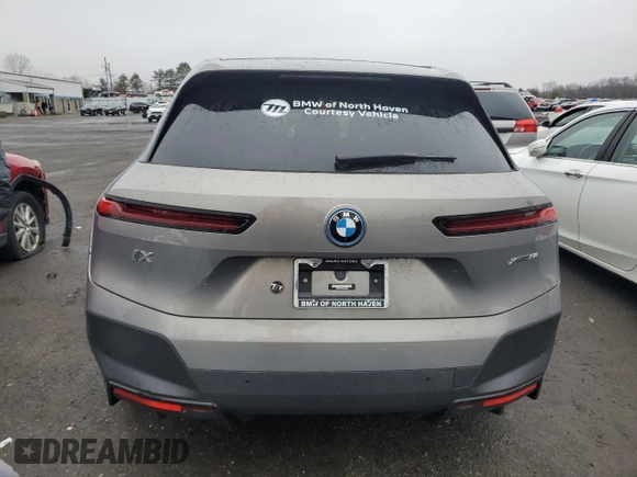 2023 BMW iX xDrive50 with VIN WB523CF03PCM84985, listed as a Copart auction lot 44174314 with 2,220 mi miles. Bid and sale history available at carsss.com. Image 6.