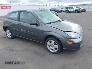 2004 Ford Focus ZX3 z VIN 3FAFP313X4R104412, wystawiony jako IAAI lot #42533436 z przebiegiem 159 833 mil mil oraz . Historia ofert i sprzedaży dostępna na DreamBid. Obrazek 1.
