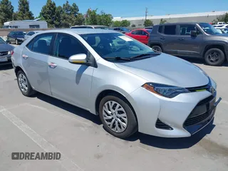 2018 Toyota Corolla L z VIN 2T1BURHE5JC101432, wystawiony jako IAAI lot #42303429 z przebiegiem 111 007 mil mil oraz . Historia ofert i sprzedaży dostępna na DreamBid. Obrazek 1.