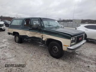 1990 GMC Suburban z VIN 1GKGR26K8LF528125, wystawiony jako Copart lot #84931724 z przebiegiem Nie podano mil oraz Szkody całkowita. Historia ofert i sprzedaży dostępna na DreamBid. Obrazek 4.