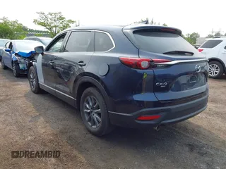 2023 Mazda CX-9 Touring with VIN JM3TCBCY6P0642838, listed as a IAAI auction lot 42407123 with 15,181 mi miles and . Bid and sale history available at DreamBid. Image 3.