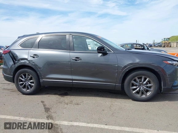 2021 Mazda CX-9 Sport with VIN JM3TCBBY7M0520437, listed as a IAAI auction lot 42022562 with 77,063 mi miles and . Bid and sale history available at DreamBid. Image 6.