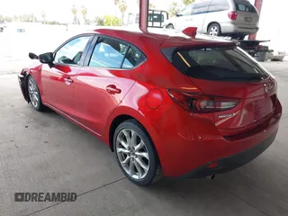 2014 Mazda 3 S Grand Touring with VIN JM1BM1M38E1200696, listed as a IAAI auction lot 41906426 with 50,048 mi miles and . Bid and sale history available at DreamBid. Image 3.