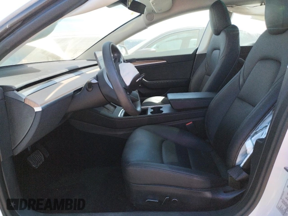 2023 Tesla Model 3 with VIN 5YJ3E1EA6PF423070, listed as a Copart auction lot 52029985 with 19,541 mi miles and Salvage Title. Bid and sale history available at DreamBid. Image 7.