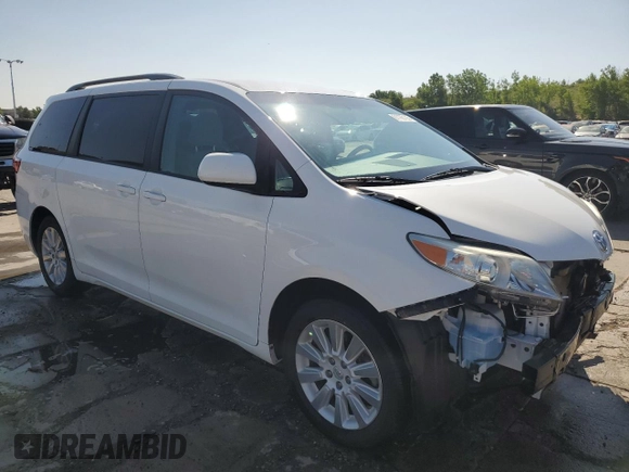 2015 Toyota Sienna LE with VIN 5TDJK3DC2FS126466, listed as a Copart auction lot 61165105 with 56,634 mi miles and Salvage title. Bid and sale history available at DreamBid. Image 4.