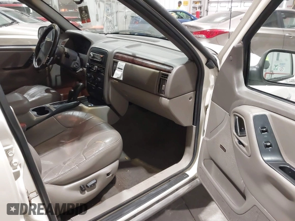 2000 Jeep Grand Cherokee Laredo z VIN 1J4GW48NXYC244327, wystawiony jako IAAI lot #41832166 z przebiegiem 250 822 mil mil oraz . Historia ofert i sprzedaży dostępna na DreamBid. Obrazek 5.