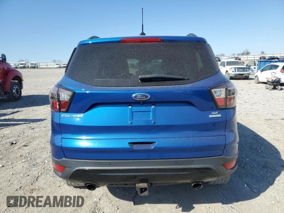 2017 Ford Escape SE with VIN 1FMCU0G96HUB59479, listed as a Copart auction lot 48711935 with 94,404 mi miles and Clean Title. Bid and sale history available at DreamBid. Image 6.