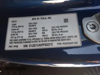 2023 Tesla Model 3 with VIN 5YJ3E1EA5PF652212, listed as a Copart auction lot 57348395 with 8,780 mi miles and Salvage title. Bid and sale history available at DreamBid. Image 13.