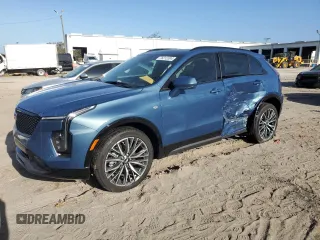 2024 Cadillac XT4 FWD Sport with VIN 1GYFZER40RF249101, listed as a Copart auction lot 76312304 with 1,969 mi miles and Salvage title. Bid and sale history available at DreamBid. Image 1.