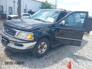 1998 Ford Expedition XLT with VIN 1FMRU176XWLB30950, listed as a IAAI auction lot 42704595 with 303,838 mi miles and . Bid and sale history available at DreamBid. Image 2.