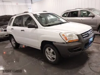 2007 Kia Sportage LX with VIN KNDJF724877399530, listed as a IAAI auction lot 41696698 with 124967 miles. Bid and sale history available at carsss.com. Image 1.