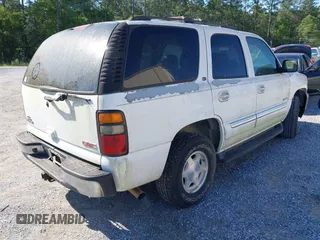 2005 GMC Yukon SLT z VIN 1GKEC13T15J147023, wystawiony jako IAAI lot #41993666 z przebiegiem 250 216 mil mil oraz . Historia ofert i sprzedaży dostępna na DreamBid. Obrazek 4.
