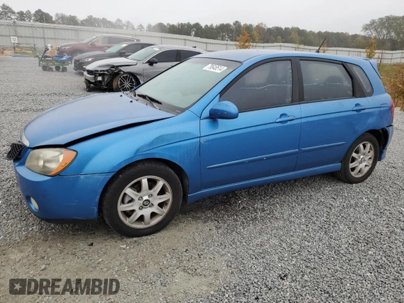 2005 Kia Spectra with VIN KNAFE161955108612, listed as a Copart auction lot 79648514 with 156,963 mi miles and Salvage Title. Bid and sale history available at carsss.com. Image 1.