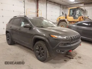 2015 Jeep Cherokee Trailhawk with VIN 1C4PJMBSXFW525218, listed as a IAAI auction lot 42032130 with 164,289 mi miles and . Bid and sale history available at DreamBid. Image 1.