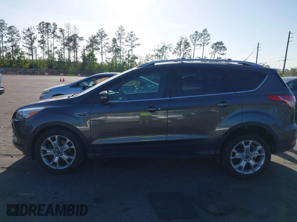2016 Ford Escape Titanium with VIN 1FMCU9J94GUA63359, listed as a IAAI auction lot 41954514 with 94,315 mi miles. Bid and sale history available at carsss.com. Image 14.