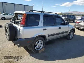 2000 Honda CR-V LX with VIN JHLRD1849YC047923, listed as a Copart auction lot 77041664 with 235,211 mi miles and Salvage Title. Bid and sale history available at carsss.com. Image 3.