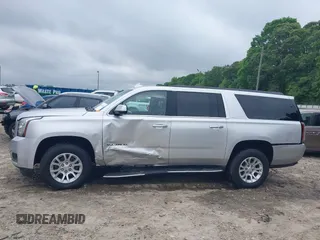 2019 GMC Yukon XL SLT z VIN 1GKS1GKC0KR242408, wystawiony jako IAAI lot #42144783 z przebiegiem Nie podano mil oraz . Historia ofert i sprzedaży dostępna na DreamBid. Obrazek 13.