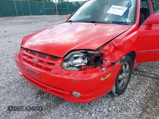 2003 Hyundai Accent GL z VIN KMHCG35CX3U247788, wystawiony jako IAAI lot #42254692 z przebiegiem 89 560 mil mil oraz . Historia ofert i sprzedaży dostępna na DreamBid. Obrazek 6.