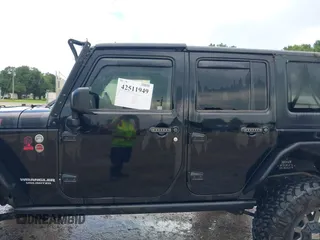 2015 Jeep Wrangler Unlimited Rubicon Hard Rock with VIN 1C4HJWFG0FL674700, listed as a IAAI auction lot 42511949 with 138,370 mi miles and . Bid and sale history available at DreamBid. Image 14.