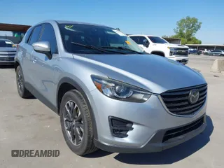 2016 Mazda CX-5 Grand Touring with VIN JM3KE2DY1G0765502, listed as a IAAI auction lot 40512229 with 122,728 mi miles. Bid and sale history available at carsss.com. Image 1.
