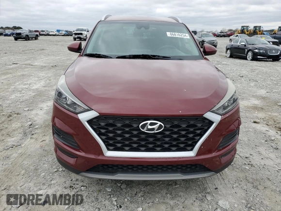2019 Hyundai Tucson Sport with VIN KM8J33AL0KU875219, listed as a Copart auction lot 86816254 with 82,829 mi miles and Salvage Title. Bid and sale history available at carsss.com. Image 5.