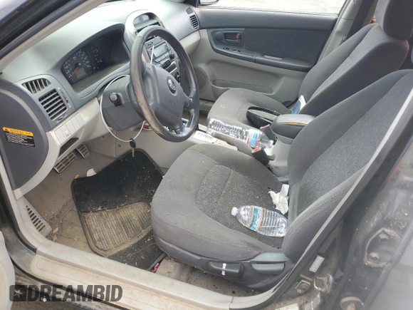 2005 Kia Spectra with VIN KNAFE162655074198, listed as a Copart auction lot 71015104 with 200,819 mi miles and Salvage Title. Bid and sale history available at DreamBid. Image 7.