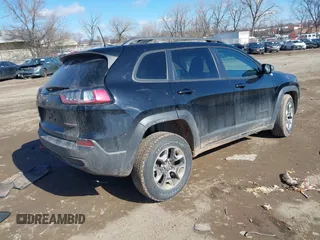 2019 Jeep Cherokee Trailhawk with VIN 1C4PJMBX6KD399568, listed as a IAAI auction lot 41645861 with 75,807 mi miles and . Bid and sale history available at DreamBid. Image 4.