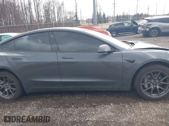 2023 Tesla Model 3 with VIN 5YJ3E1EAXPF693693, listed as a IAAI auction lot 41709704 with 12,473 mi miles and . Bid and sale history available at DreamBid. Image 13.