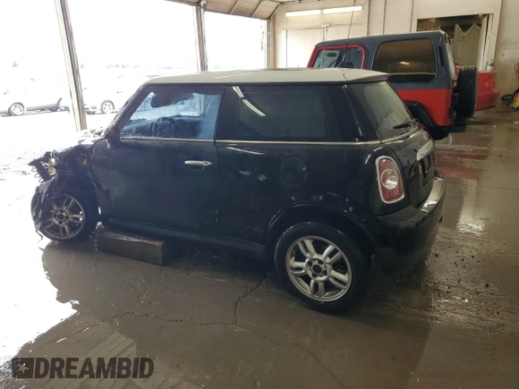 2011 MINI Hardtop with VIN WMWSU3C59BT099759, listed as a Copart auction lot 53995355 with 141,575 mi miles and Salvage Title. Bid and sale history available at DreamBid. Image 2.