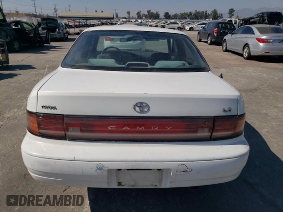 1992 Toyota Camry LE with VIN 4T1SK12E0NU077223, listed as a Copart auction lot 71787194 with 239,027 mi miles and Salvage Title. Bid and sale history available at carsss.com. Image 6.