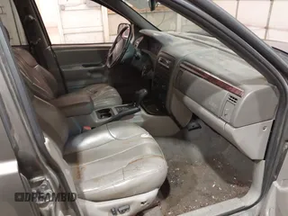 2000 Jeep Grand Cherokee Laredo z VIN 1J4GW48S1YC277710, wystawiony jako IAAI lot #42033564 z przebiegiem Nie podano mil oraz . Historia ofert i sprzedaży dostępna na DreamBid. Obrazek 5.