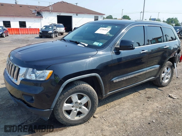2011 Jeep Grand Cherokee Laredo with VIN 1J4RR4GG1BC534787, listed as a IAAI auction lot 42486840 with 186,229 mi miles and . Bid and sale history available at DreamBid. Image 2.