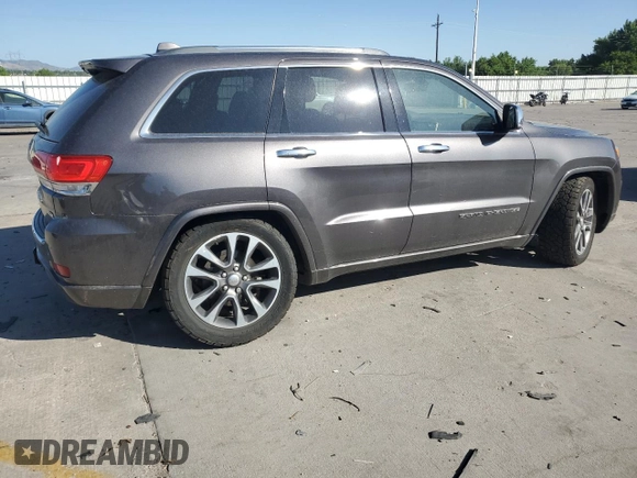 2017 Jeep Grand Cherokee Overland with VIN 1C4RJFCG9HC601806, listed as a Copart auction lot 61786275 with 122,898 mi miles and Salvage title. Bid and sale history available at DreamBid. Image 3.