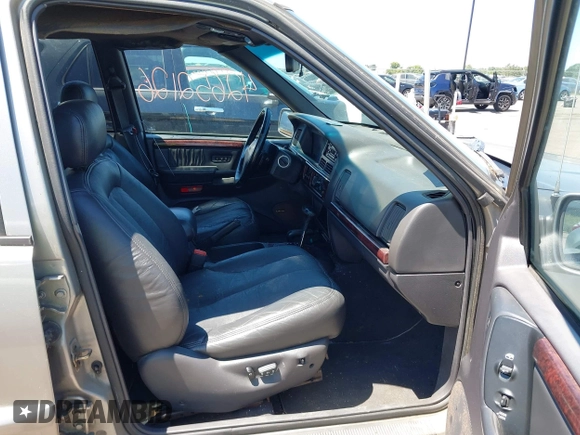 1998 Jeep Grand Cherokee Limited z VIN 1J4GZ88Z4WC328450, wystawiony jako IAAI lot #42652126 z przebiegiem 166 576 mil mil oraz . Historia ofert i sprzedaży dostępna na DreamBid. Obrazek 5.