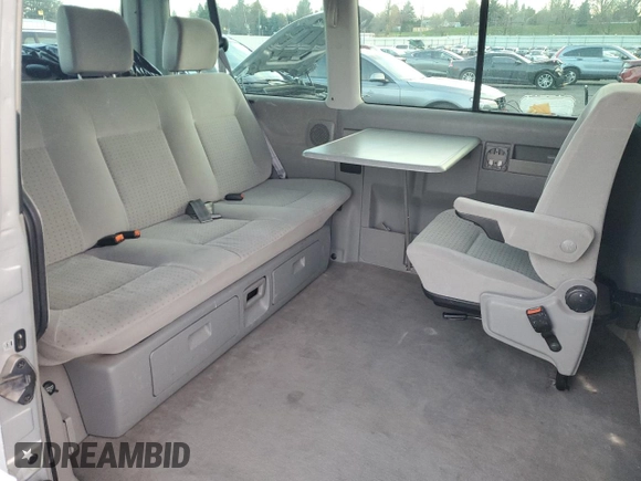 2003 Volkswagen EuroVan MV с VIN WV2MB47053H002505, выставлен на аукционе Copart как лот 83840884 с пробегом 250 786 миль миль и Чистый • Clean title. История ставок и продаж доступна на DreamBid. Изображение 11.