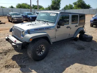 2016 Jeep Wrangler Unlimited Rubicon with VIN 1C4BJWFG9GL242338, listed as a Copart auction lot 58815395 with 82,849 mi miles and Salvage title. Bid and sale history available at DreamBid. Image 1.