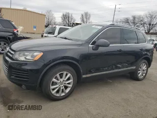 2014 Volkswagen Touareg Sport with VIN WVGEF9BP1ED011619, listed as a Copart auction lot 48023215 with 159,105 mi miles and Clean Title. Bid and sale history available at DreamBid. Image 1.
