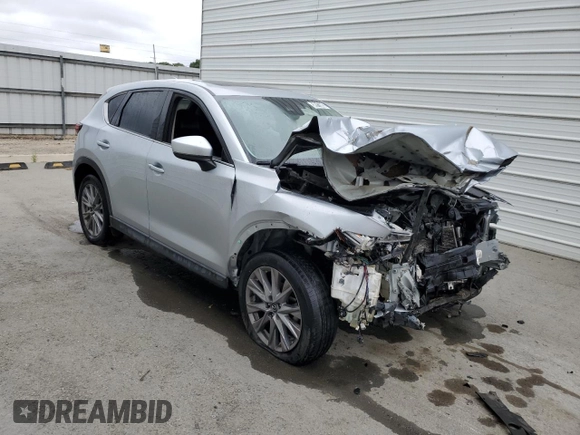 2021 Mazda CX-5 Grand Touring z VIN JM3KFADM7M1339081, wystawiony jako Copart lot #58913585 z przebiegiem Nie podano mil oraz Szkoda całkowita • Salvage title. Historia ofert i sprzedaży dostępna na DreamBid. Obrazek 4.