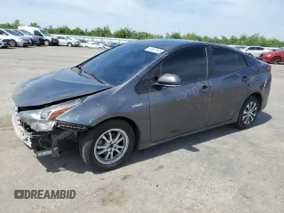 2020 Toyota Prius L Eco z VIN JTDKARFU9L3105675, wystawiony jako Copart lot #54587165 z przebiegiem 130 560 mil mil oraz Szkoda całkowita • Salvage title. Historia ofert i sprzedaży dostępna na DreamBid. Obrazek 1.