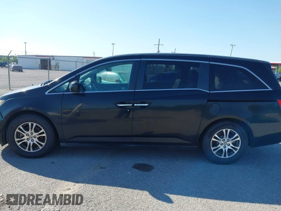 2011 Honda Odyssey EX-L with VIN 5FNRL5H66BB058333, listed as a IAAI auction lot 42172045 with 215,723 mi miles and . Bid and sale history available at carsss.com. Image 14.