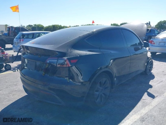 2024 Tesla Model Y with VIN 7SAYGDED2RA331436, listed as a IAAI auction lot 41713562 with NaN miles. Bid and sale history available at carsss.com. Image 4.
