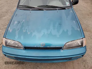 1993 Suzuki Swift z VIN 2S2AC35S5P6601869, wystawiony jako Copart lot #44993725 z przebiegiem 166 429 mil mil oraz Szkody całkowita. Historia ofert i sprzedaży dostępna na DreamBid. Obrazek 13.