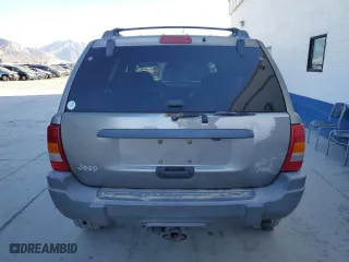 1999 Jeep Grand Cherokee Laredo with VIN 1J4GW58N9XC730311, listed as a Copart auction lot 77774544 with 0 mi miles and Salvage Title. Bid and sale history available at carsss.com. Image 6.
