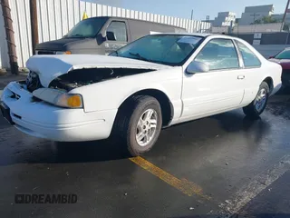 1996 Ford Thunderbird LX with VIN 1FALP6240TH185576, listed as a IAAI auction lot 41493910 with 100,880 mi miles and . Bid and sale history available at DreamBid. Image 2.