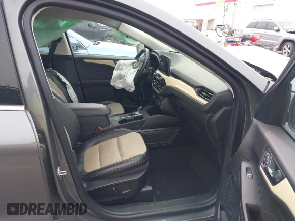 2021 Ford Escape Titanium with VIN 1FMCU9J92MUA27097, listed as a IAAI auction lot 41542774 with 14,822 mi miles and . Bid and sale history available at carsss.com. Image 5.
