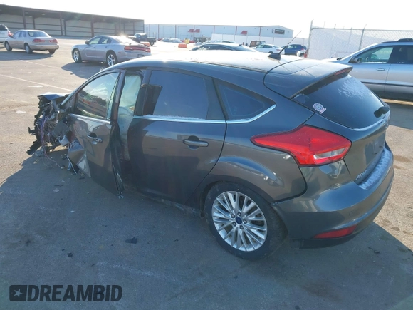 2015 Ford Focus Titanium z VIN 1FADP3N23FL368324, wystawiony jako IAAI lot #41387070 z przebiegiem Nie podano mil oraz . Historia ofert i sprzedaży dostępna na DreamBid. Obrazek 3.