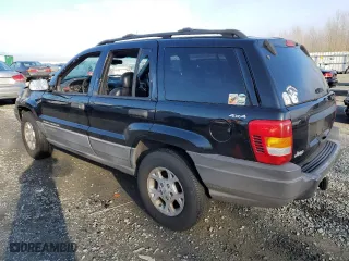 1999 Jeep Grand Cherokee Laredo with VIN 1J4GW58N1XC737706, listed as a Copart auction lot 83107914 with 0 mi miles and Salvage Title. Bid and sale history available at carsss.com. Image 2.