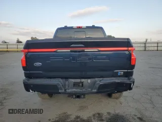 2023 Ford F-150 Lightning Pro with VIN 1FTVW1EV1PWG16263, listed as a Copart auction lot 54439535 with 12,023 mi miles and Salvage Title. Bid and sale history available at DreamBid. Image 6.
