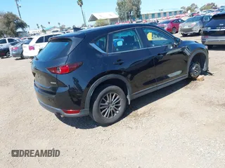 2020 Mazda CX-5 Sport with VIN JM3KFABM2L0761184, listed as a IAAI auction lot 41847768 with 47,582 mi miles. Bid and sale history available at carsss.com. Image 4.